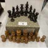 AN EARLY 20TH CENTURY BOXWOOD AND EBONY CHESS SET