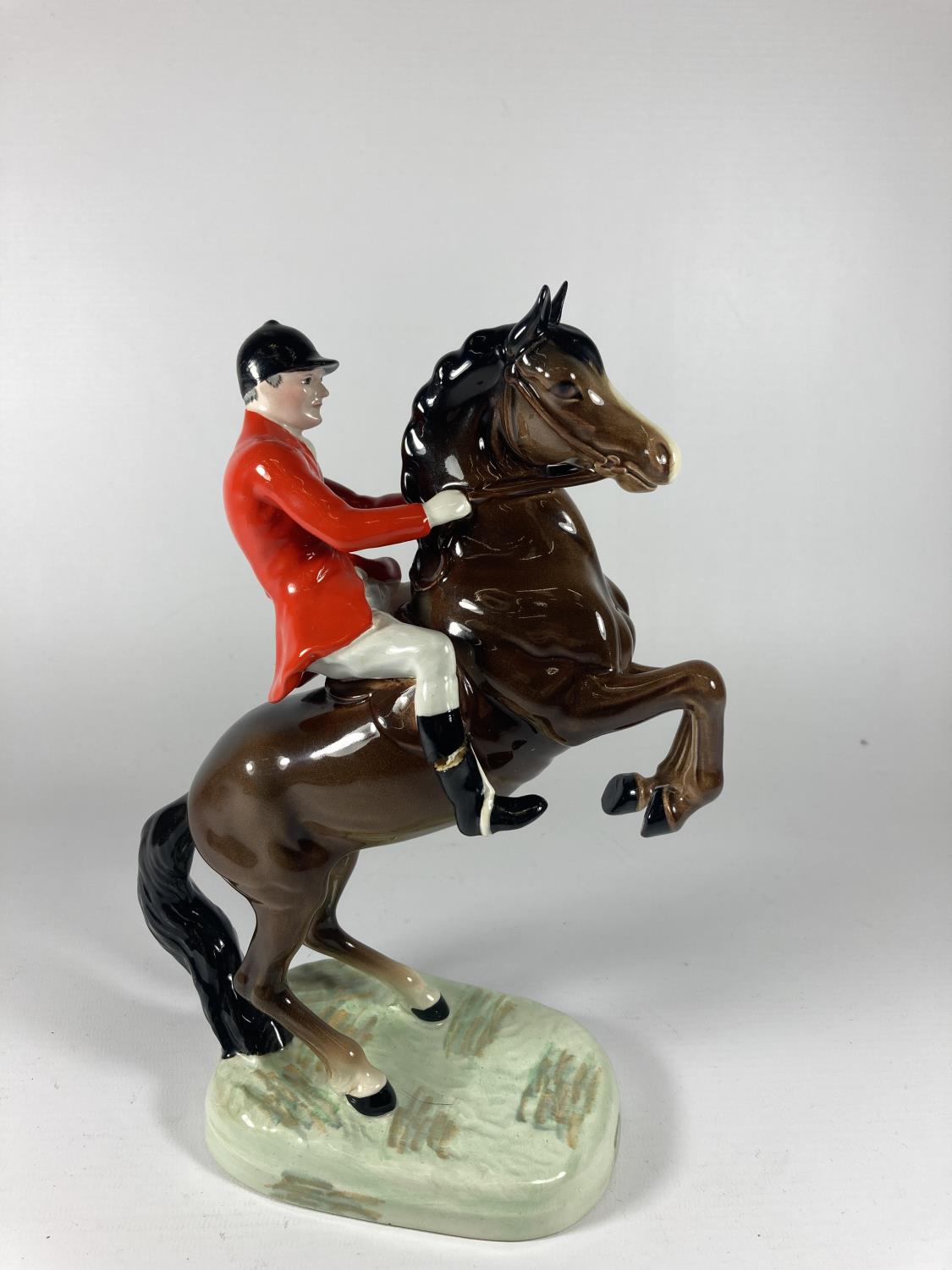 A BESWICK REARING HUNTSMAN (RIDERS FOOT A/F)