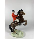 A BESWICK REARING HUNTSMAN (RIDERS FOOT A/F)