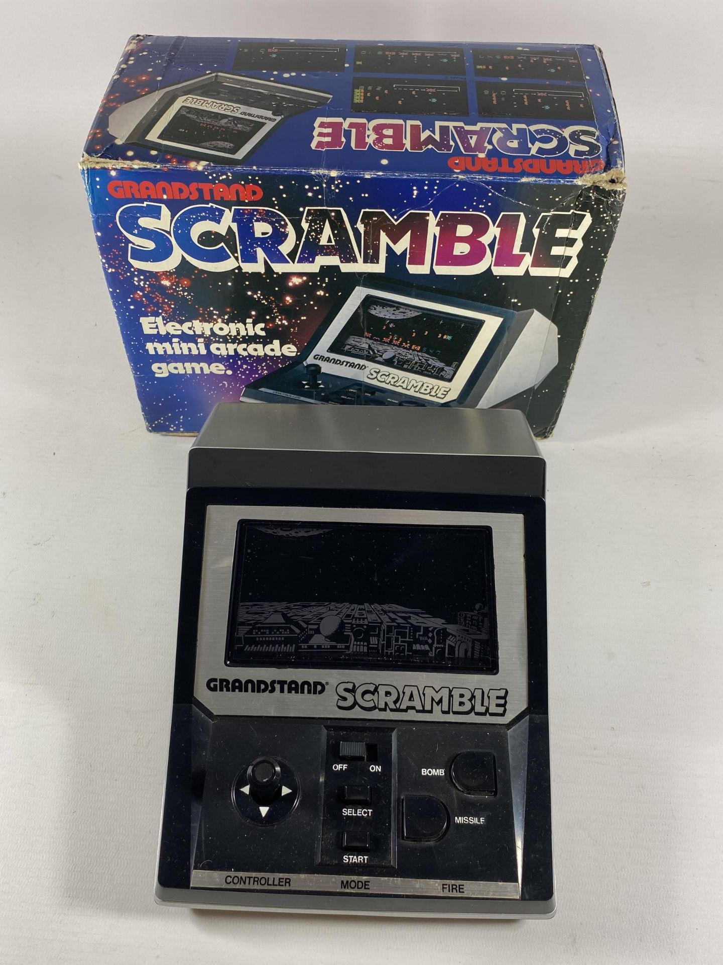 A RETRO BOXED GRANDSTAND SCRAMBLE ELECTRONIC MINI ARCADE GAME