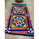 A LARGE FABRIC WALL HANGING - APPROX 12FT LONG (IMAGE SHOWS AN UNROLLED EXAMPLE)