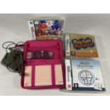 A PINK NINTENDO DS GAMES CONSOLE & GAMES