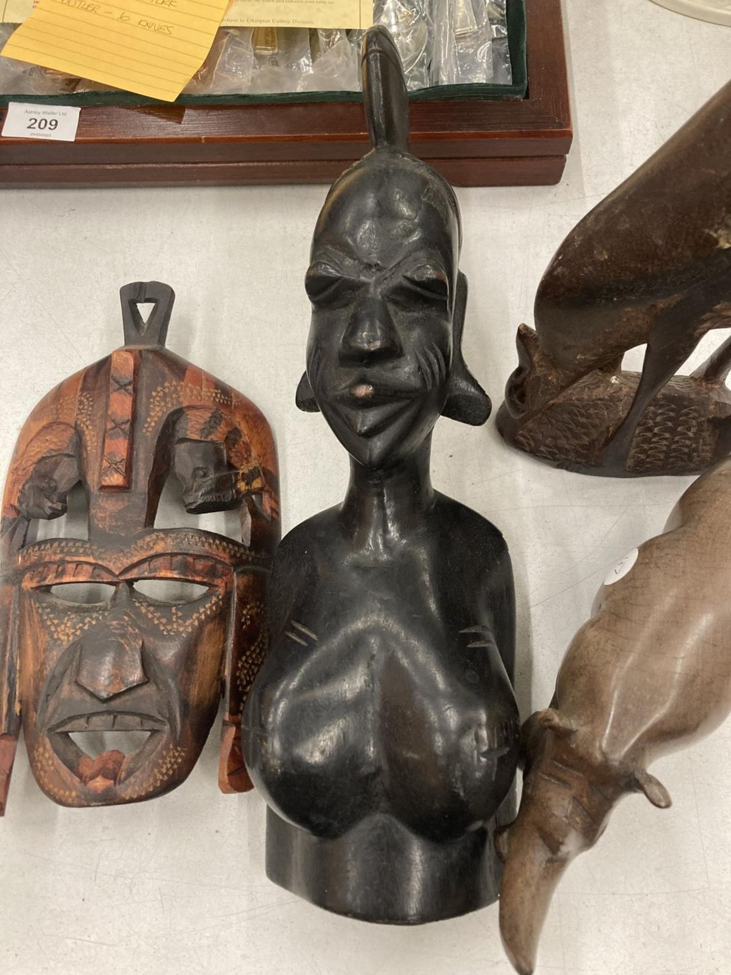 FOUR CARVED AFRICAN STYLE WOODEN FIGURES TO INCLUDE A BUST OF A LADY, A MASK, RHINO AND DEER - Image 3 of 5