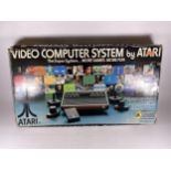 A BOXED RETRO ATARI VIDEO COMPUTER SYSTEM CONSOLE