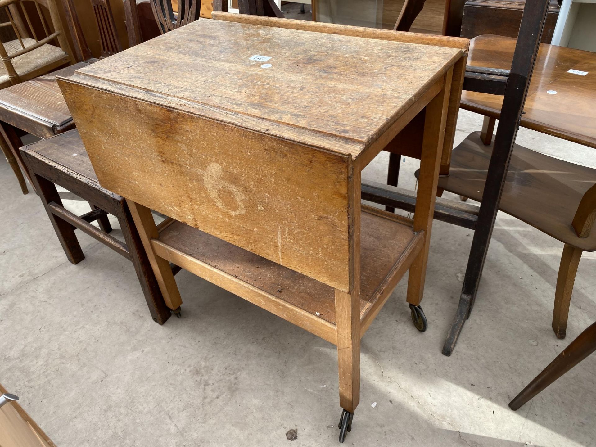 AN OAK DROP-LEAF TROLLEY AND SIX BAR CLOTHES AIRER