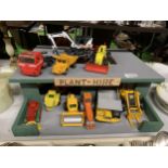 A PLANT HIRE GARAGE WITH TWELVE VARIOUS VEHICLES AND MACHINES