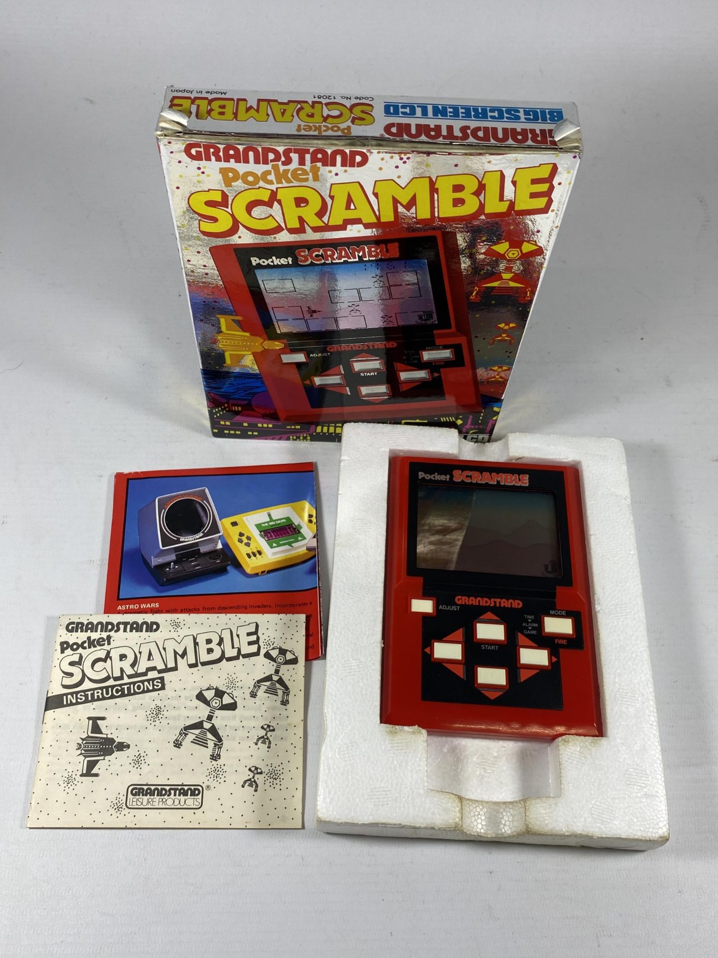 A RETRO BOXED GRANDSTAND POCKET SCRAMBLE ARCADE GAME