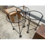 THREE CAST IRON METAL RING OUTDOOR STANDS