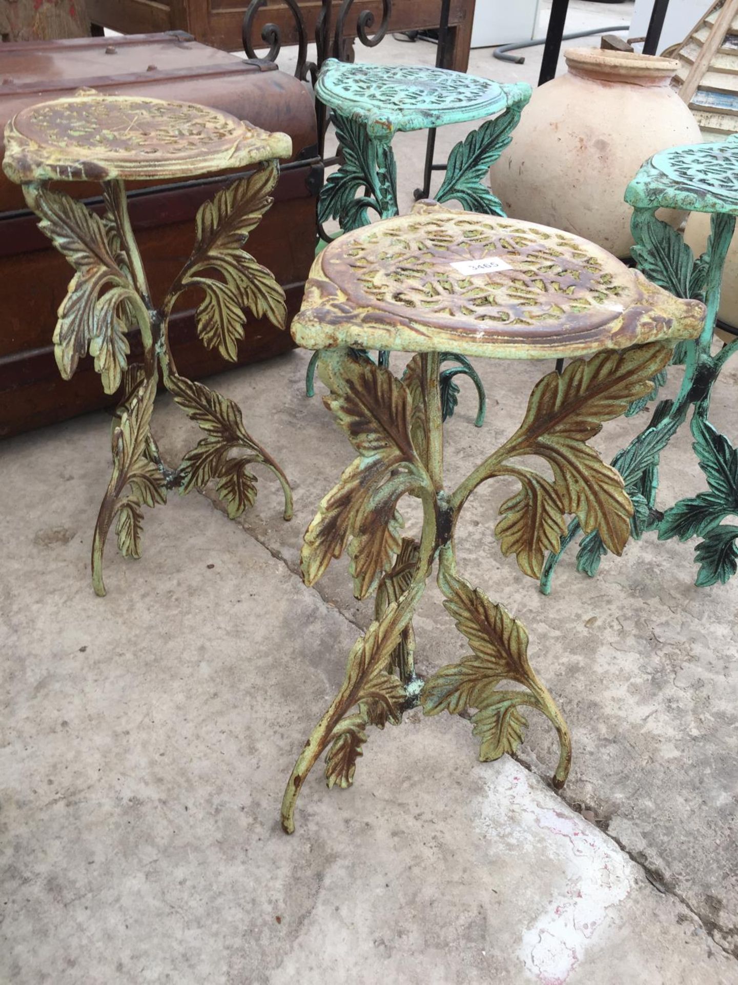 A PAIR OF PIERCED CAST IRON PLANT STANDS