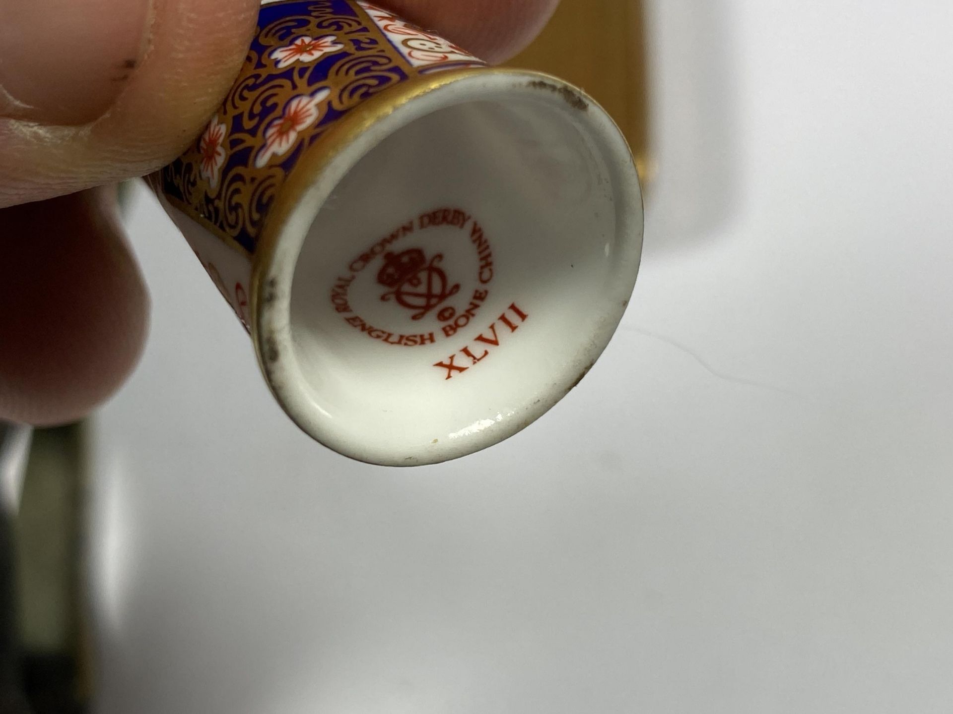 A GROUP OF THREE ITEMS - ROYAL CROWN DERBY THIMBLE, BRASS VESTA CASE AND VICTORIAN FIGURAL DOOR - Image 3 of 4