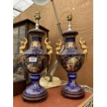 A PAIR OF BLUE CERAMIC ORIENTAL STYLE TABLE LAMPS WITH CHERUB DESIGN