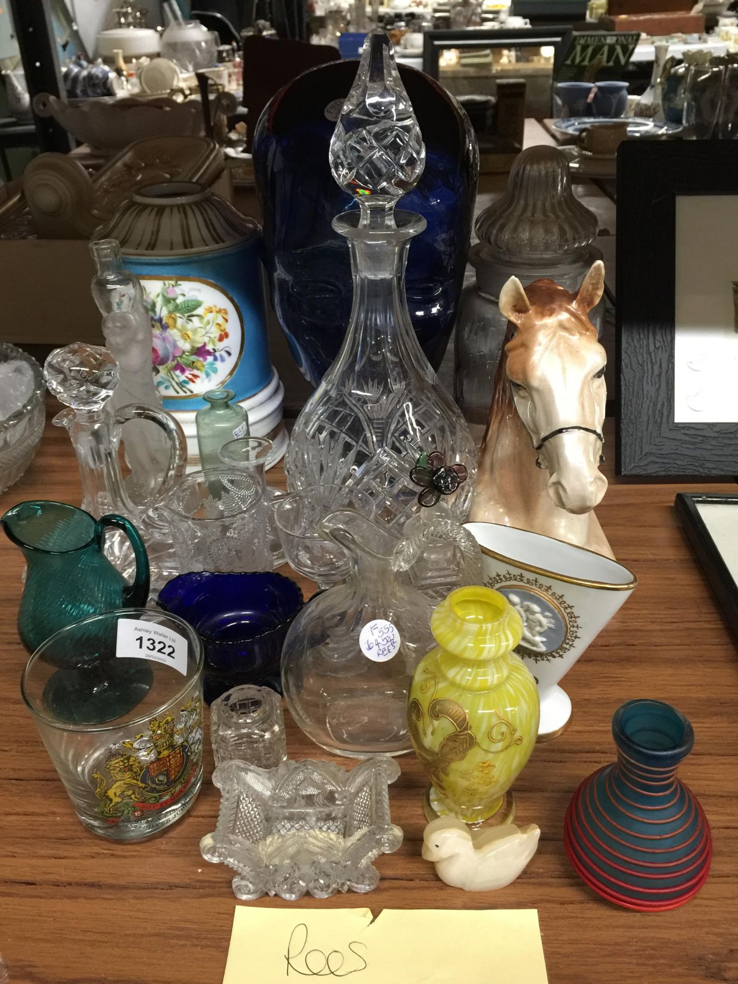 A MIXED LOT TO INCLUDE A LARGE BLUE GLASS HEAD, A CERAMIC HORSES HEAD, A DECANTER, GLASS JUGS, SMALL