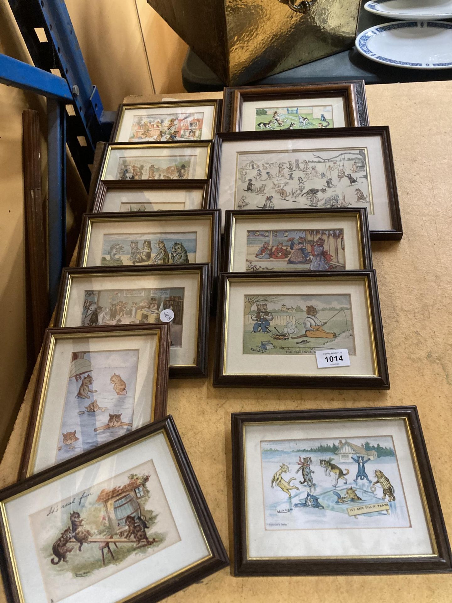A LARGE QUANTITY OF LOUIS WAIN MOUNTED AND FRAMED CAT POSTCARDS
