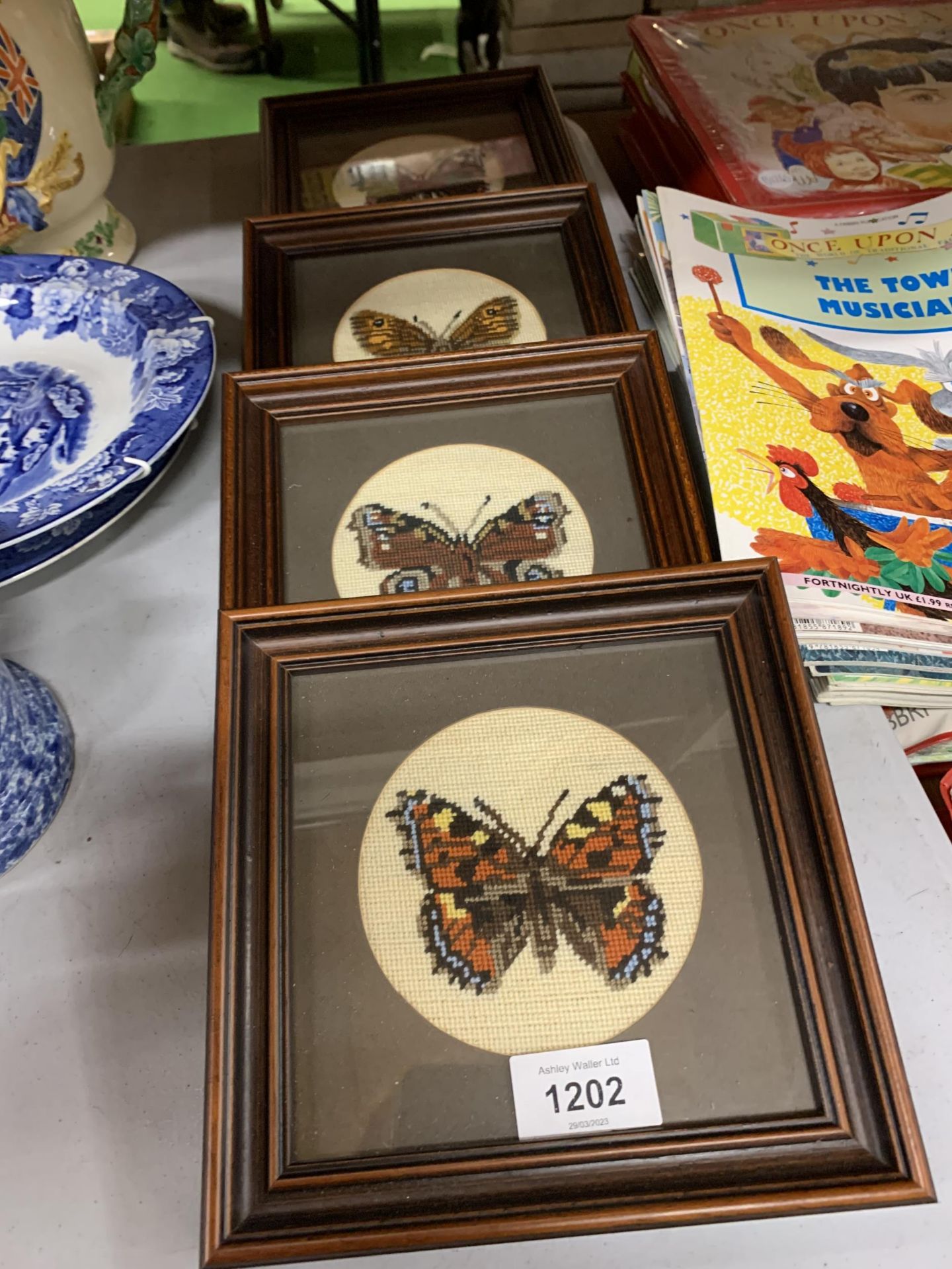 FOUR FRAMED AND MOUNTED WOOL WORK OF BUTTERFLIES