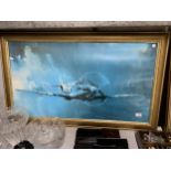 A LARGE GILT FRAMED PRINT OF A SPITFIRE AEROPLANE 102CM X 62CM