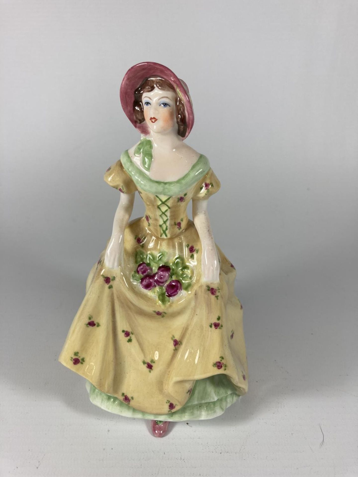 A COALPORT FIGURINE