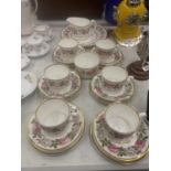 A ROYAL WORCESTER 'ROYAL GARDEN' TEASET TO INCLUDE A CAKE PLATE, CREAM JUG, SUGAR BOWL, CUPS,