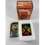 A BOXED RETRO FOLLOW SUIT WATCH TYPE GAME