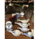 A QUANTITY OF ITEMS TO INCLUDE AN ORIENTAL STYLE TIGER, ORIENTAL TEA POURERS, JUGS, A TRINKET BOX,