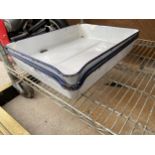 THREE BLUE AND WHITE ENAMEL COOKING TRAYS