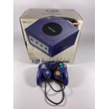 A BOXED NINTENDO GAMECUBE GAMING CONSOLE