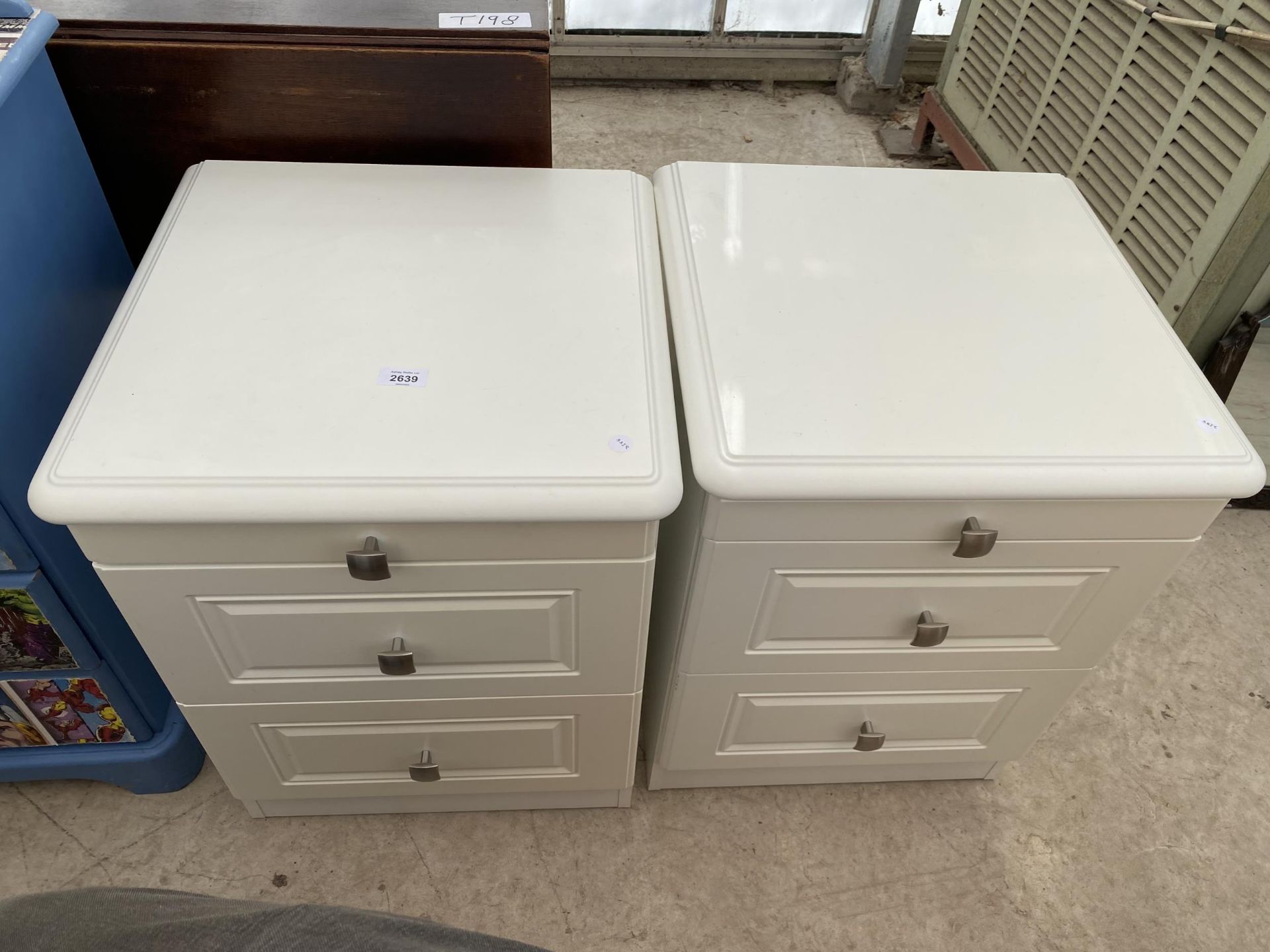 A PAIR OF MODERN TWO DRAWER BEDSIDE CHESTS WITH PULL-OUT SLIDES, 18.5" WIDE EACH