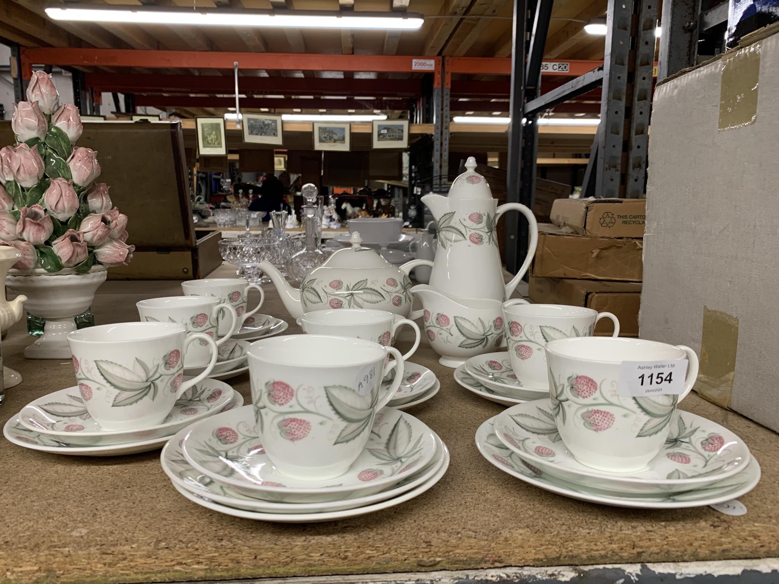 A SUSIE COOPER COFFEE AND TEA SET TO INCLUDE A TEA AND COFFEE POT, SUGAR BOWL, CREAM JUG, CUPS,