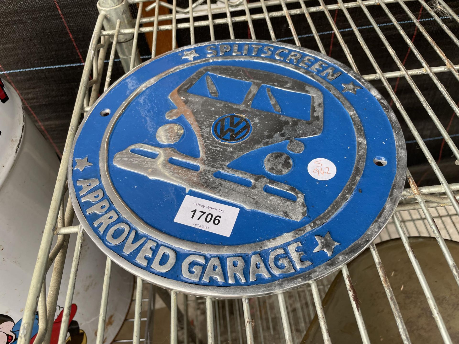 A BLUE VW CAST SIGN