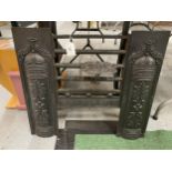 A VINTAGE CAST METAL FIREPLACE INSERT