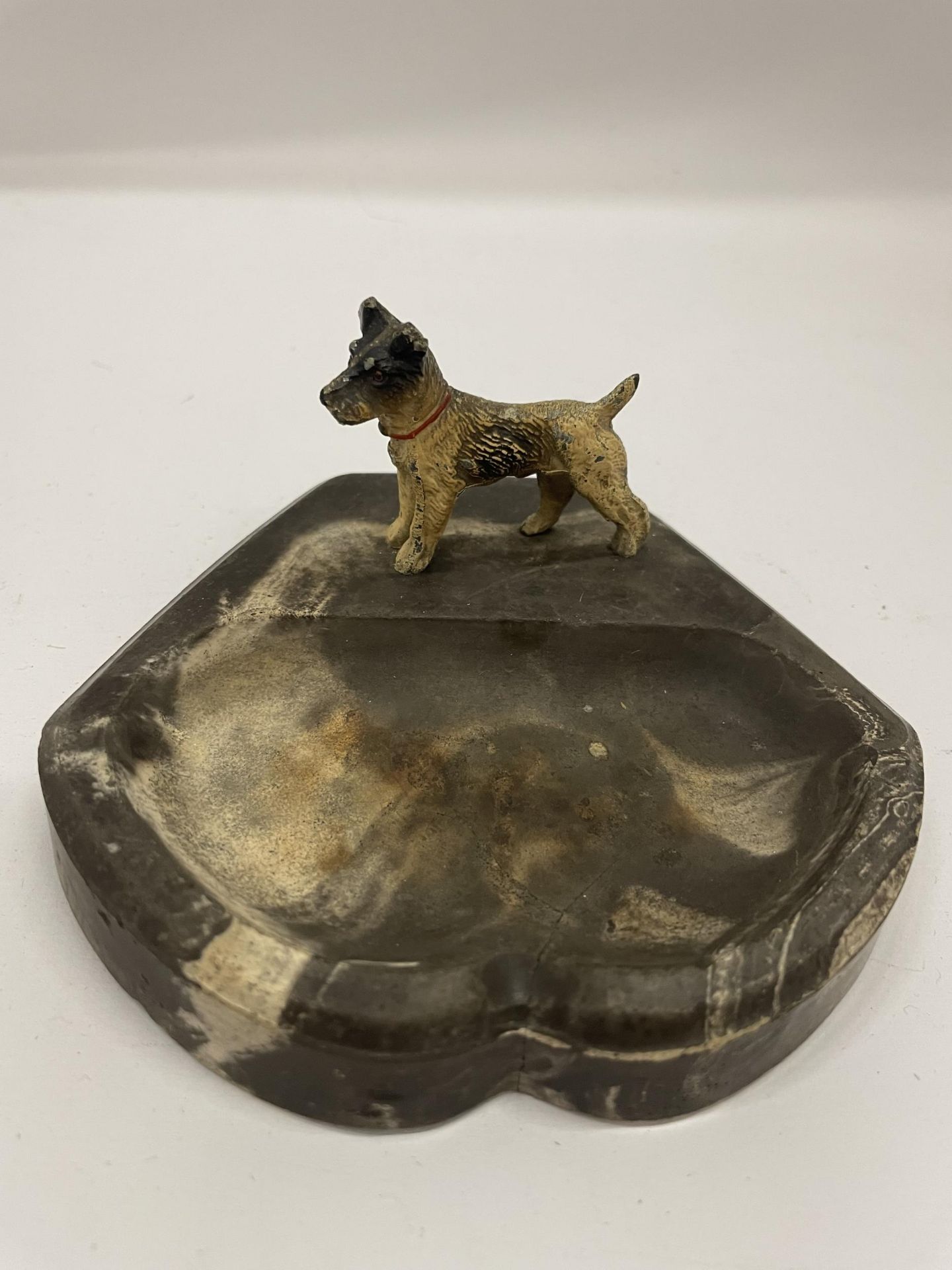 AN AUSTRIAN COLD PAINTED BRONZE MODEL OF A TERRIER IN THE FORM OF AN ASHTRAY