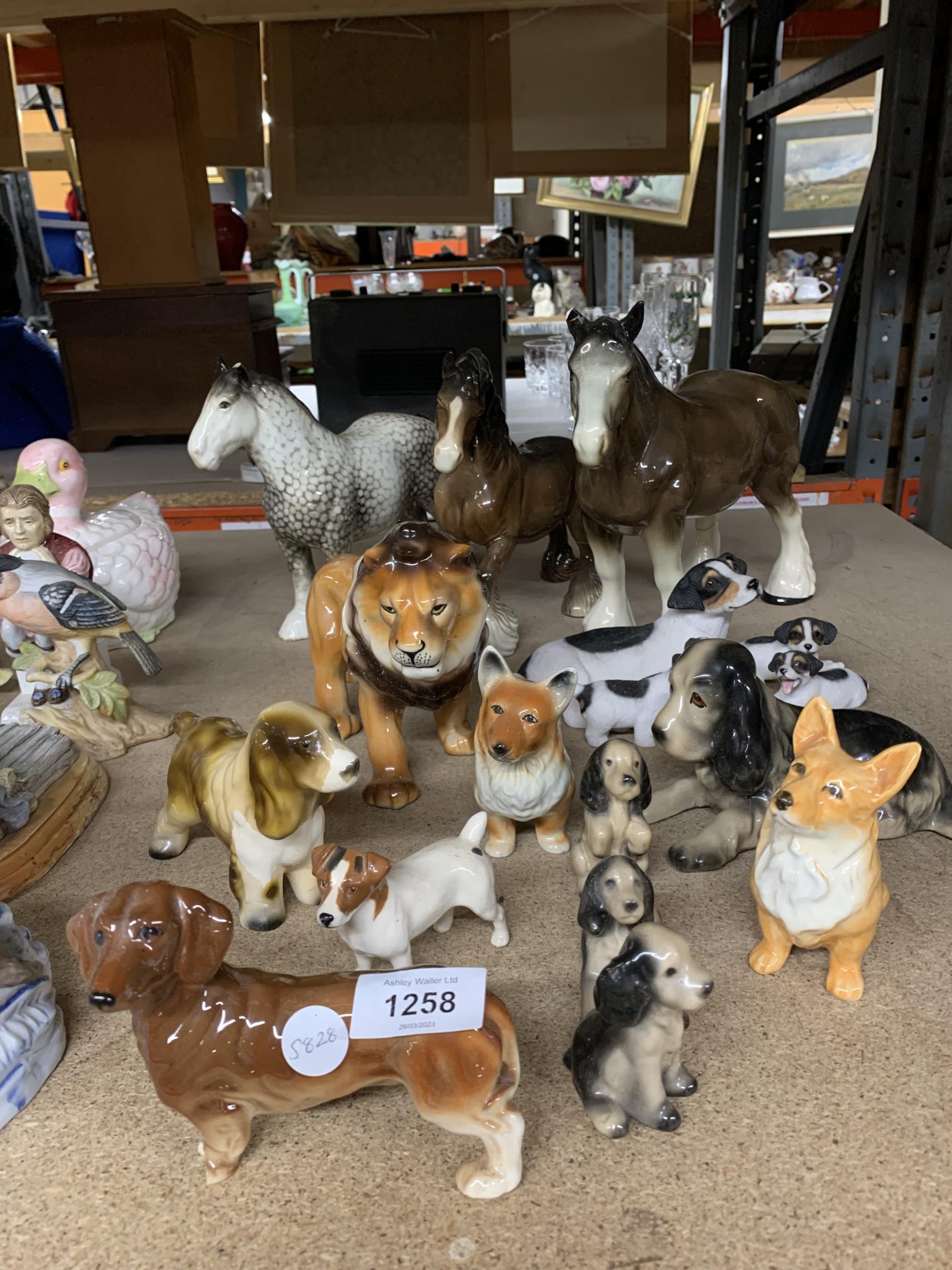 A QUANTITY OF ANIMAL FIGURES TO INCLUDE HORSES, A LION AND DOGS