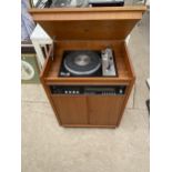 A RETRO TEAK STEREO UNIT CONTAINING A DYNATRON GOLDRING RECORD PLAYER AND A DYNATRON STEREOPHONIC