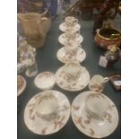 A VINTAGE CHINA PART TEASET WITH PINK FLORAL PATTERN TO INCLUDE CUPS, SAUCERS, CREAM JUG AND A SUGAR