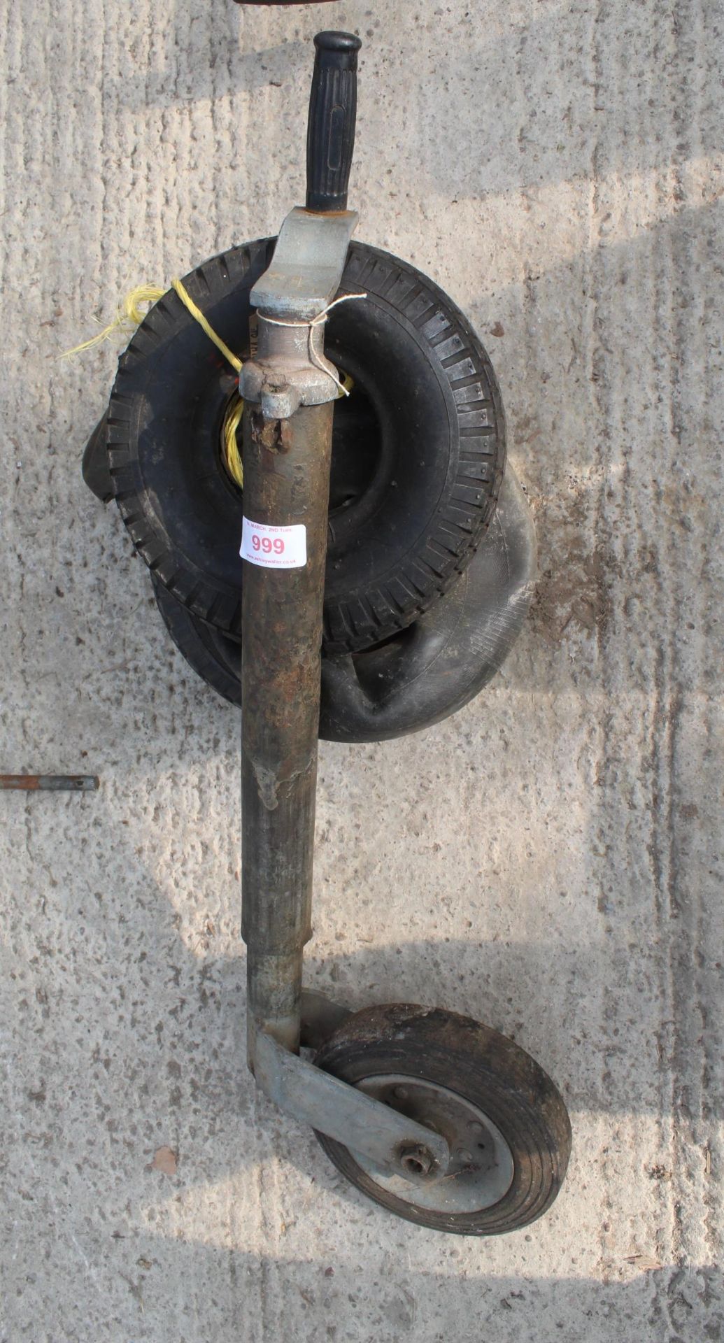 A TRAILER JOCKEY WHEEL AND FOUR RUBBER TROLLEY TYRES NO VAT