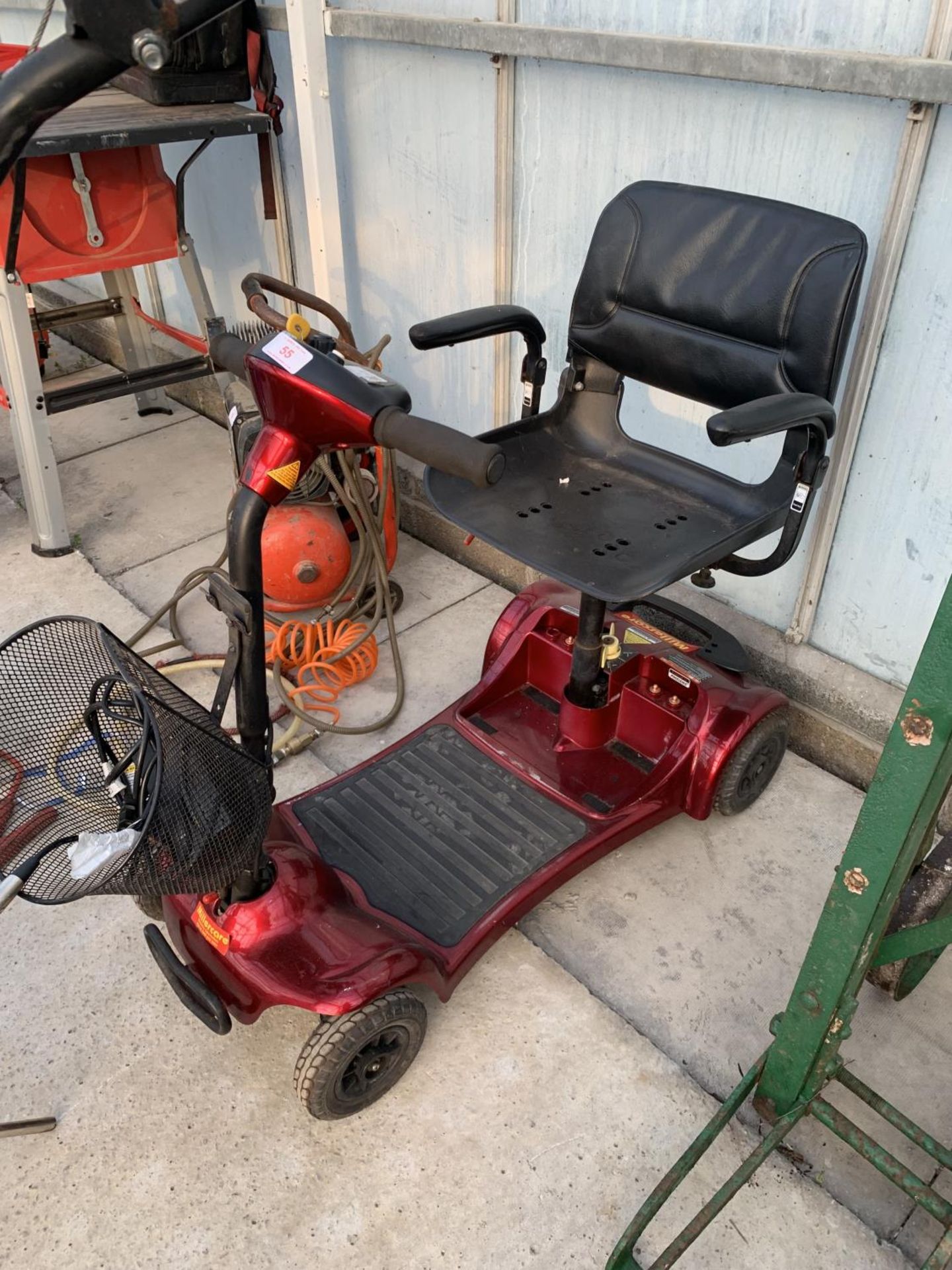 A MILLERCARE MOBILITY SCOOTER WITH KEY AND CHARGER NO VAT