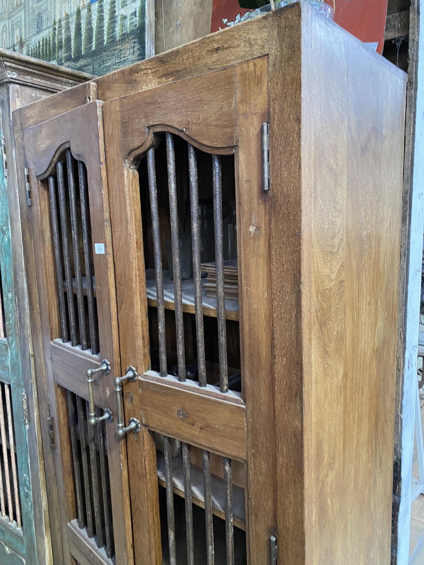 A VINTAGE INDIAN HARDWOOD OPENWORK TWO DOOR CABINET WITH BRASS HASP + IRON BAR, 35" WIDE - Image 2 of 3