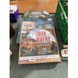 AN ASSORTMENT OF WESTERN AND WAR BOOK AND DVD SETS