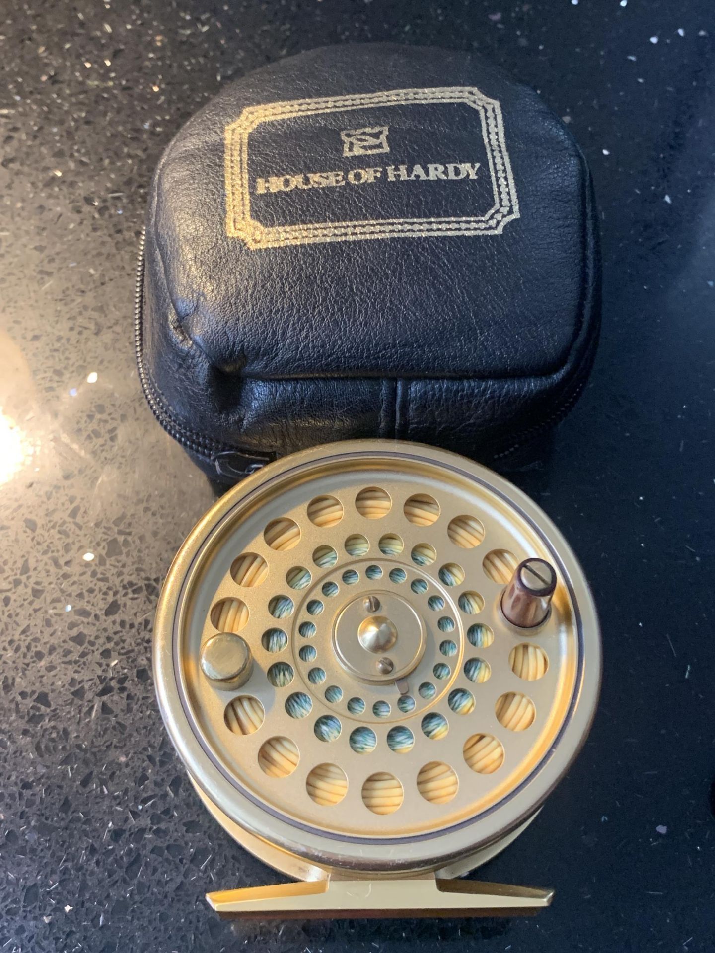 A HARDY SOVEREIGN 7/8 LTD EDITION NO.188 TROUT FLY FISHING REEL LOADED WITH HARDY DT7F LINE IN A