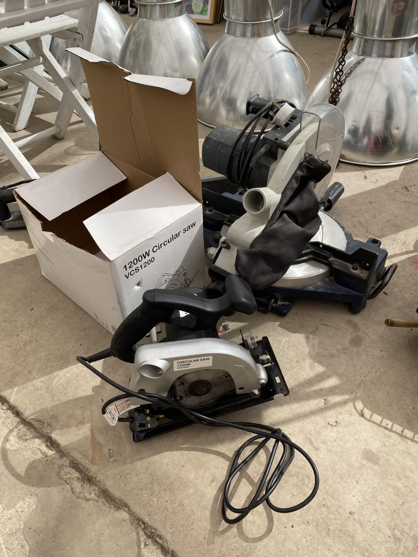 AN ELECTRIC MITRE SAW AND A FURTHER CIRCULAR SAW