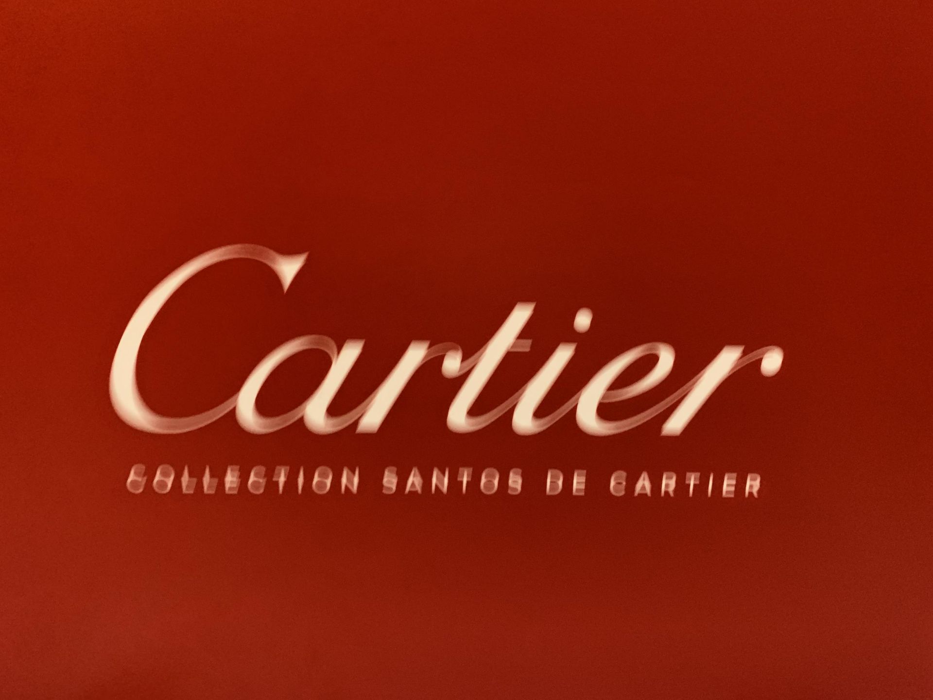 A MODERN PRINT ON BOARD ENTITLED "CARTIER COLLECTION SANTOS DE CARTIER" - Image 2 of 3