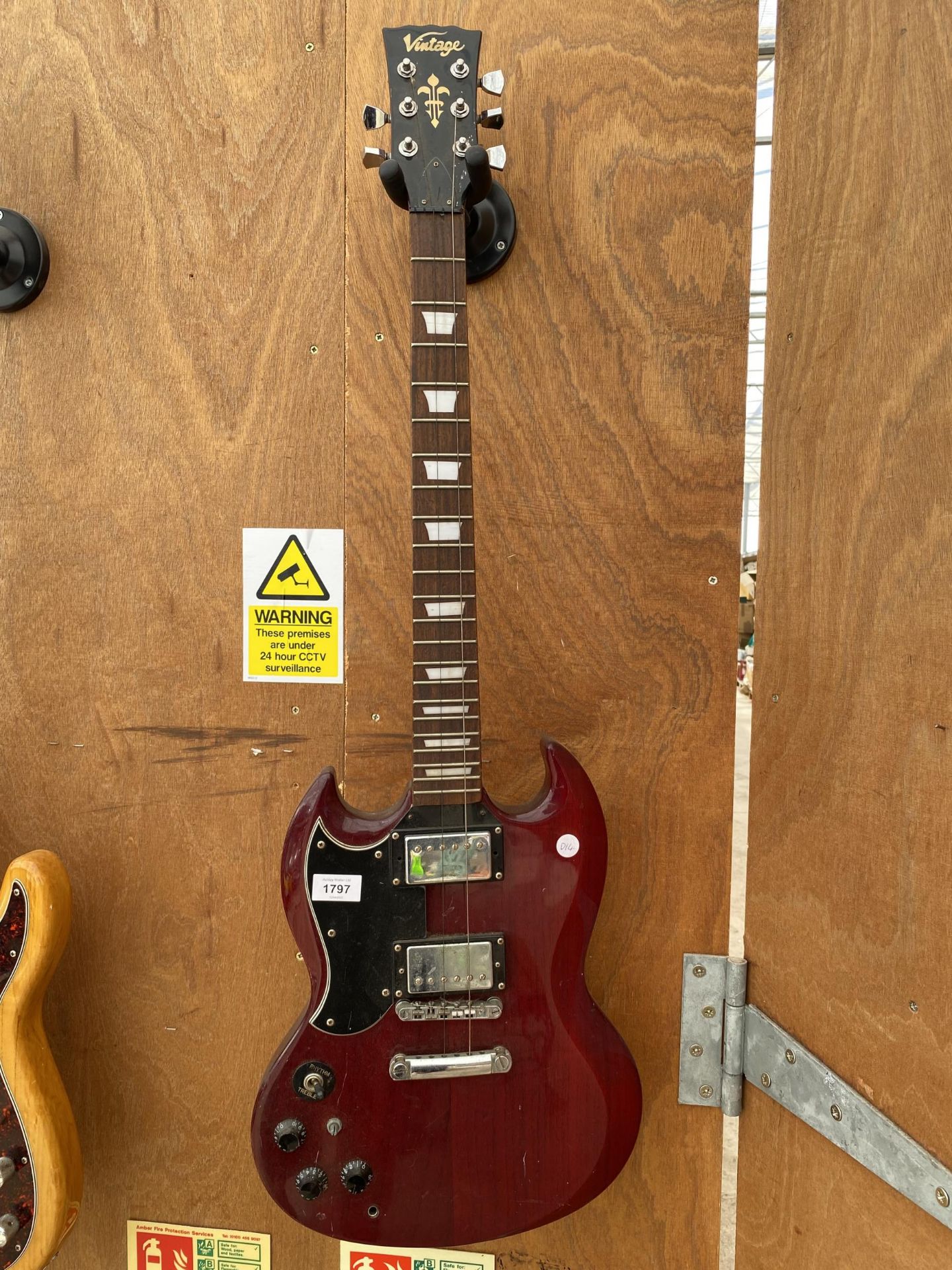 A 'VINTAGE' ELECTRIC GUITAR AND A GUITAR STAND