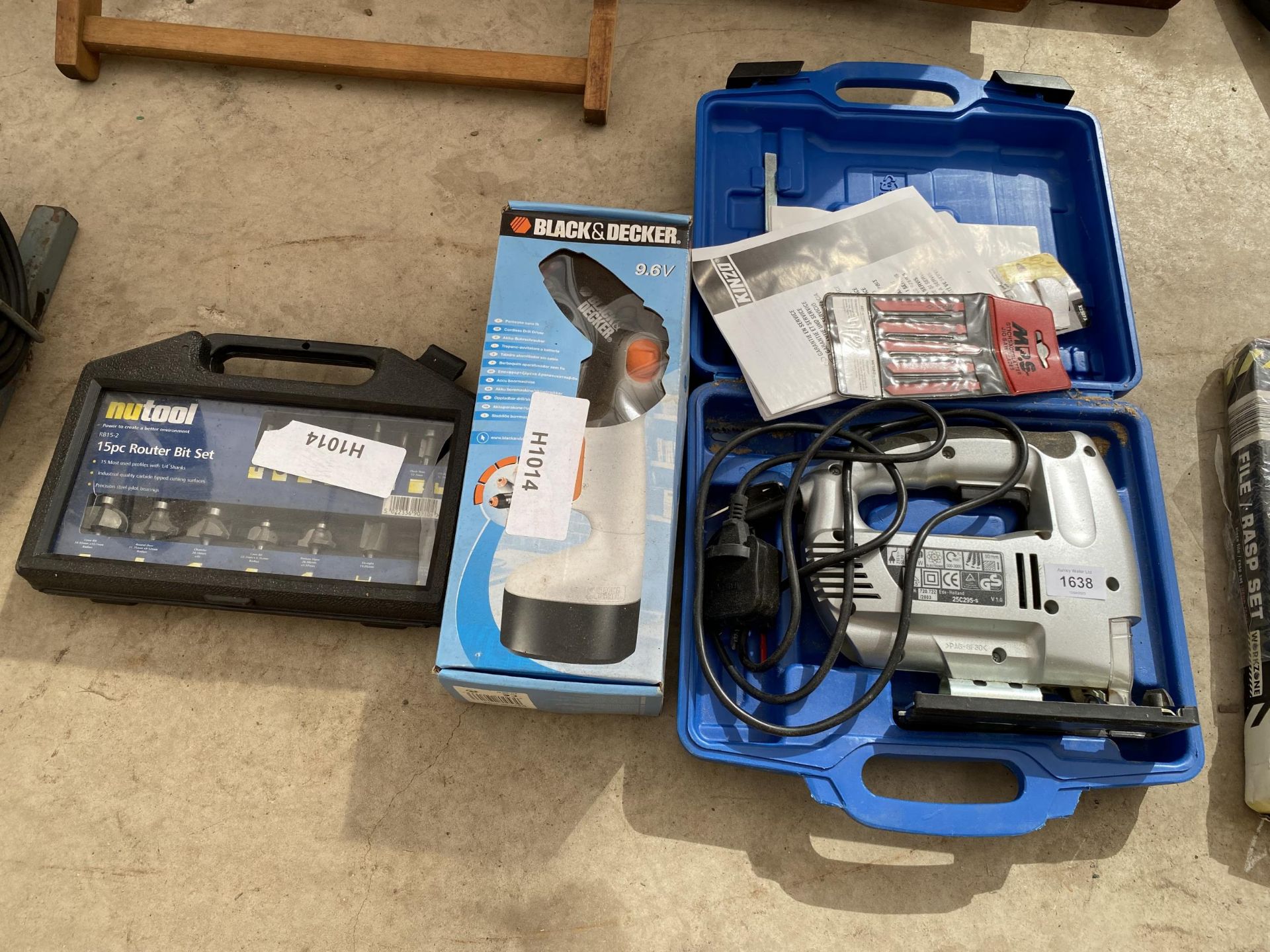 AN ASSORTMENT OF TOOLS TO INCLUDE AN ELECTRIC JIGSAW AND A ROUTER BIT SET ETC