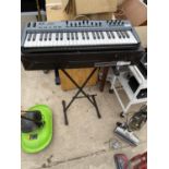 AN OXYGEN 49 ELECTRIC KEYBOARD AND STAND