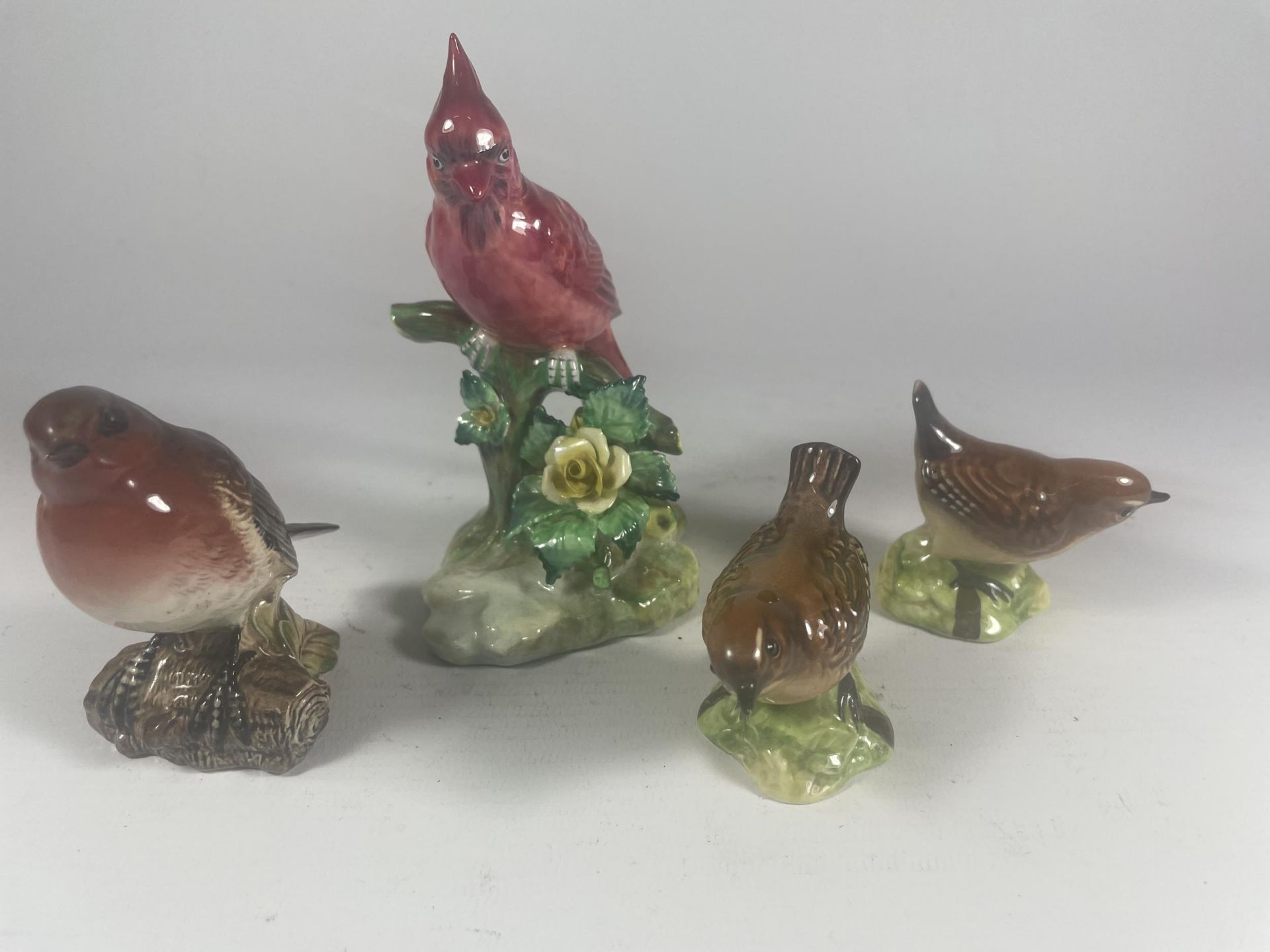 A GROUP OF FOUR BIRD FIGURES - THREE BESWICK AND A RADNOR EXAMPLE