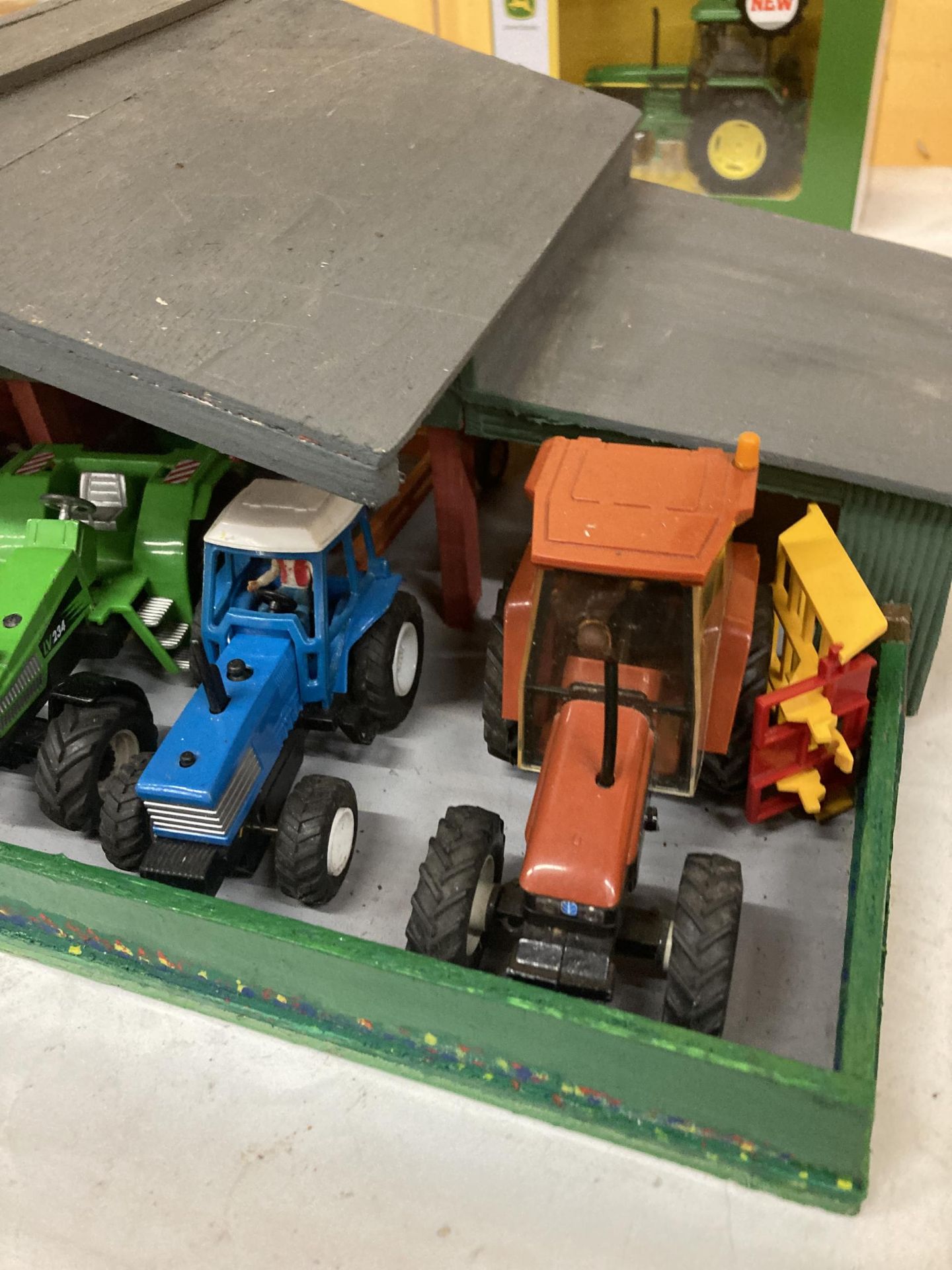 A WOODEN TRACTOR GARAGE CONTAINING A QUANTITY OF TRACTORS AND TRAILERS - Image 3 of 3