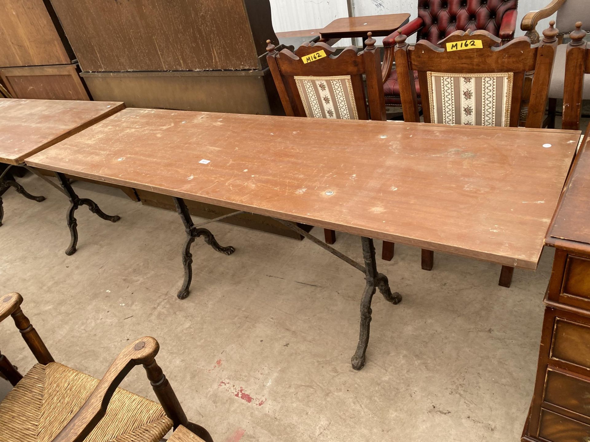 A PUB TABLE ON CAST IRON BASE, 76 X 22"