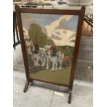 A VINTAGE WOOLWORK TAPESTRY FIRE SCREEN IN A MAHOGANY FRAME HEIGHT 71CM