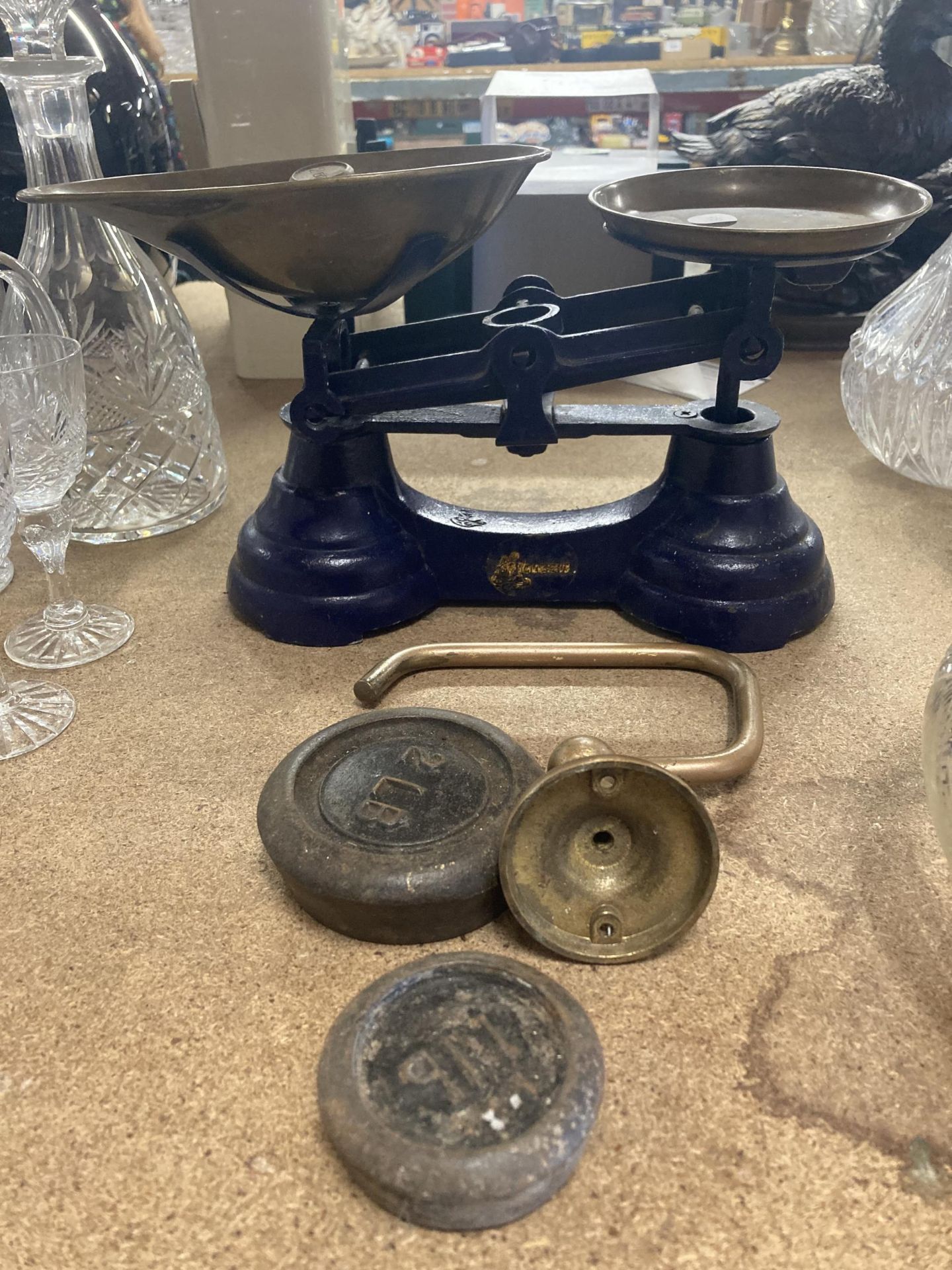A VINTAGE SET OF SCALES WITH BRASS PANS AND WEIGHTS