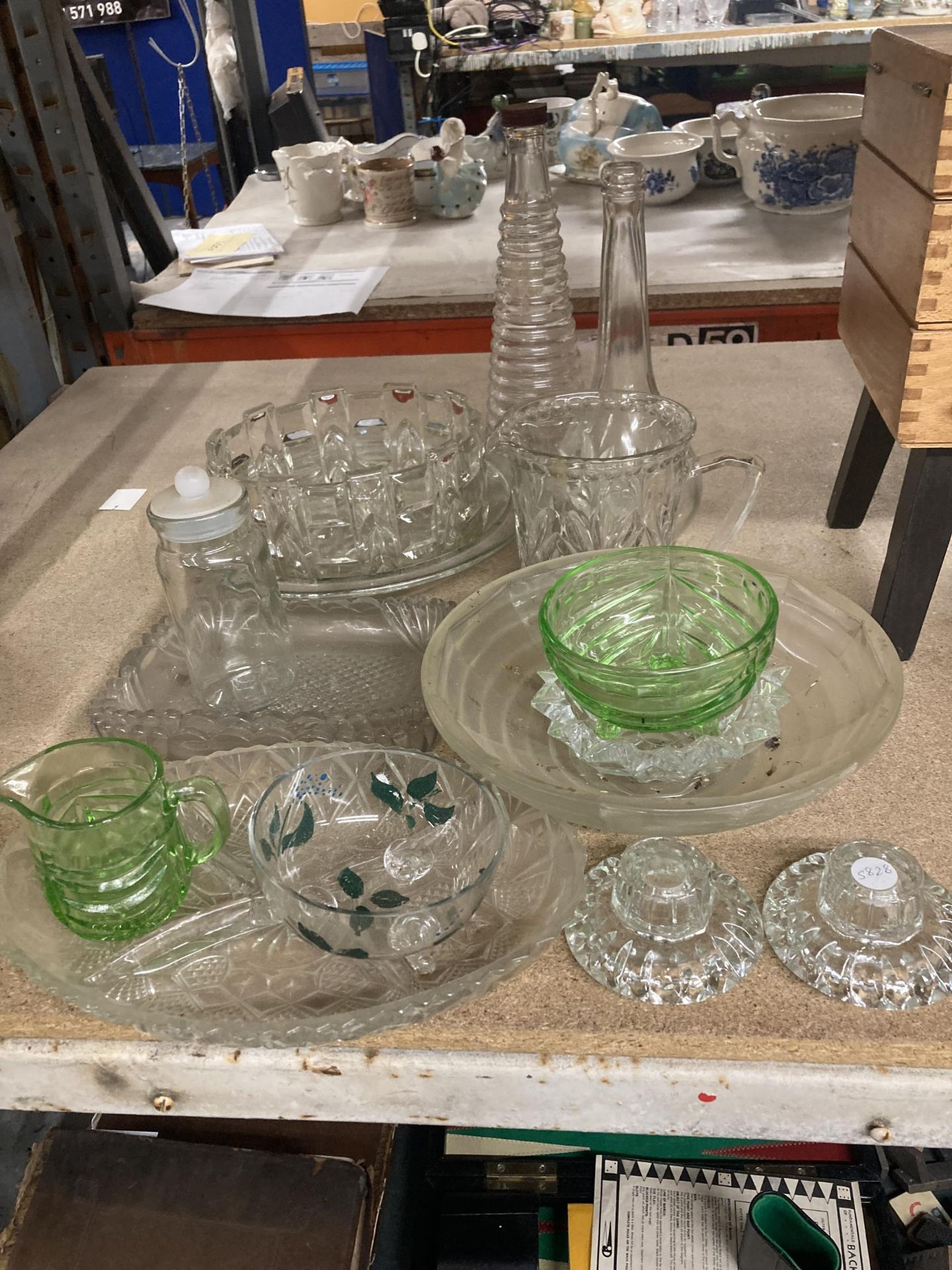 A QUANTITY OF GLASSWARE TO INCLUDE BOWLS, BOTTLES, NIBBLES DISH, CANDLESTICKS, ETC.,