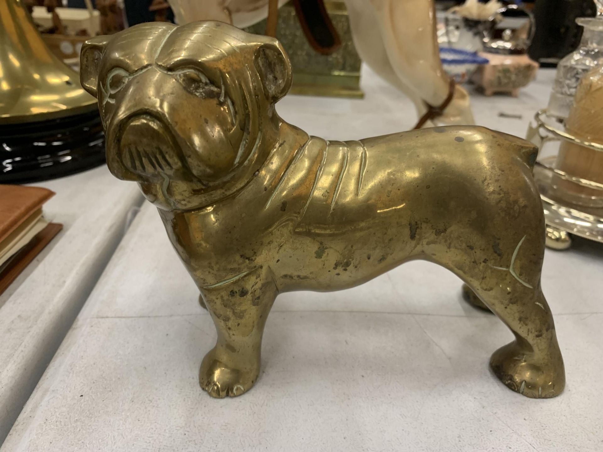 A LARGE BRASS STAFFORDSHIRE BULLDOG HEIGHT 15CM